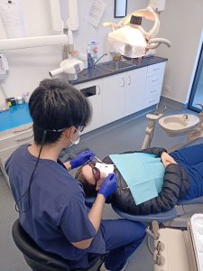 Dr. Trent Zhang providing dental care 